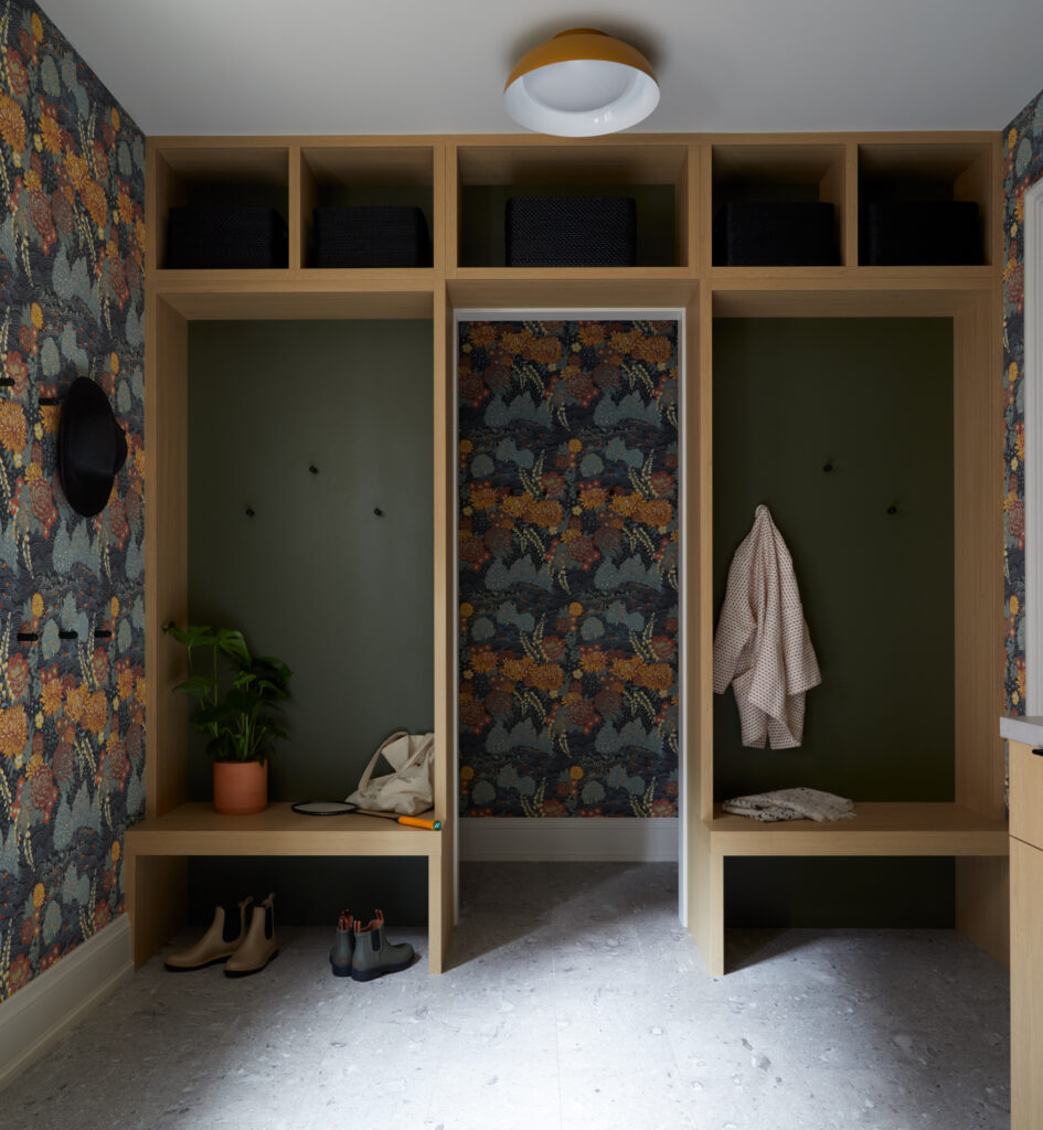 Built-in mudroom cubbies with bench seating, overhead storage and integrated coat hooks by Gillian Gillies Interiors