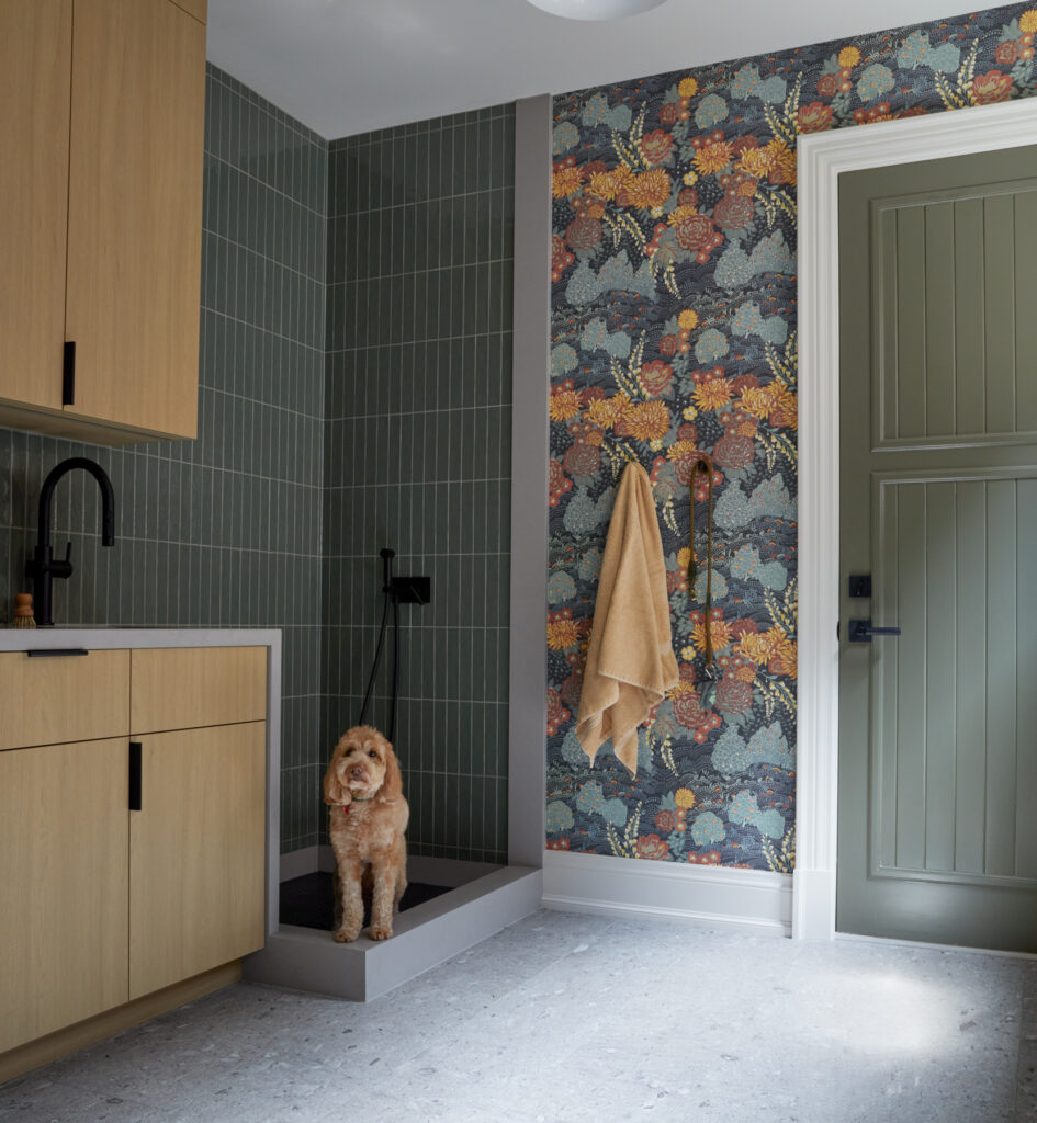 Mudroom with integrated dog wash station, tiled walls and custom cabinetry by Gillian Gillies Interiors
